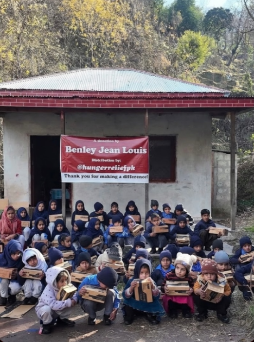 Benley Jean Louis donation — children receiving food and supplies